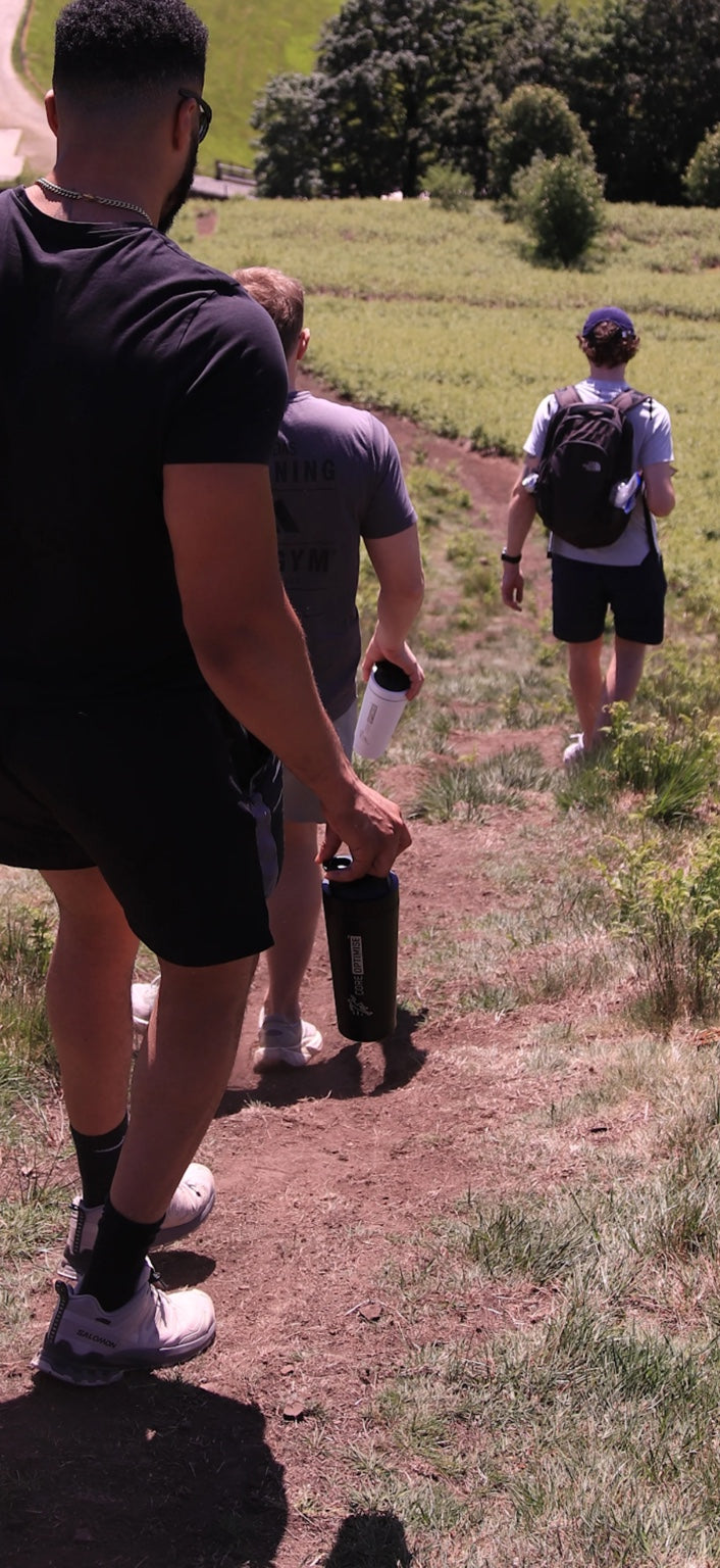 CoreOptimise founder hiking outdoors with the CoreOptimise community